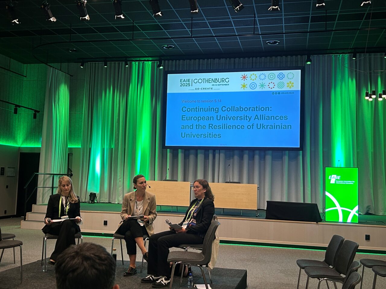 Three people sitting on chairs in a panel. Left-to-right: Iryna Ivanets (Marburg University), Christina Friesen (DAAD) & Elisabeth Schulte (Marburg University).