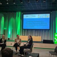 Three people sitting on chairs in a panel. Left-to-right: Iryna Ivanets (Marburg University), Christina Friesen (DAAD) & Elisabeth Schulte (Marburg University).