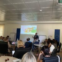 A man giving a presentation to the cross-WP participants.