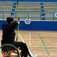 Participant practicing adapted archery.