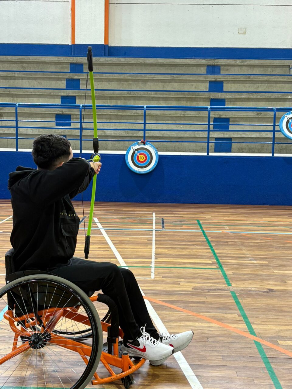 Participant practicing adapted archery.