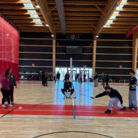 Students practicing inclusive badminton.