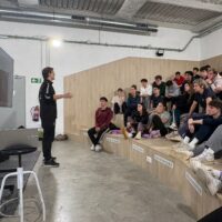 Instructor leading a workshop with students.