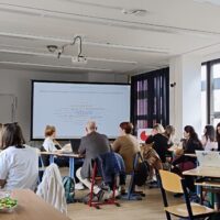 A full classroom of BIP participants listens to a presentation on virtual reality in teaching at the Faculty of Education, University of West Bohemia in Pilsen.