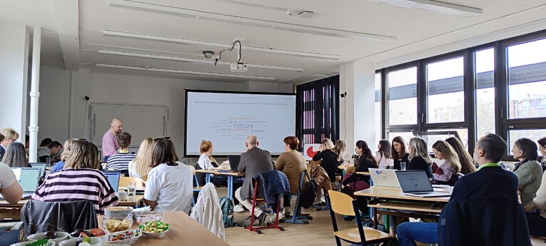 A full classroom of BIP participants listens to a presentation on virtual reality in teaching at the Faculty of Education, University of West Bohemia in Pilsen.