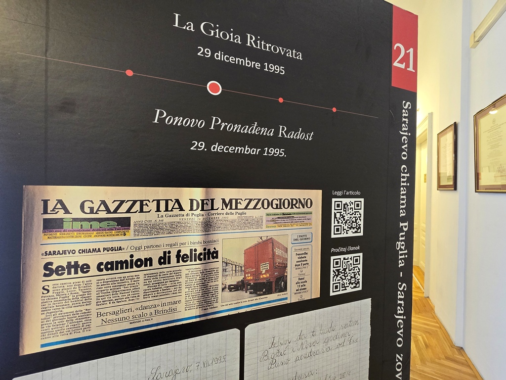 One of the information pillars from the exhibition with images, texts and QR-Codes.