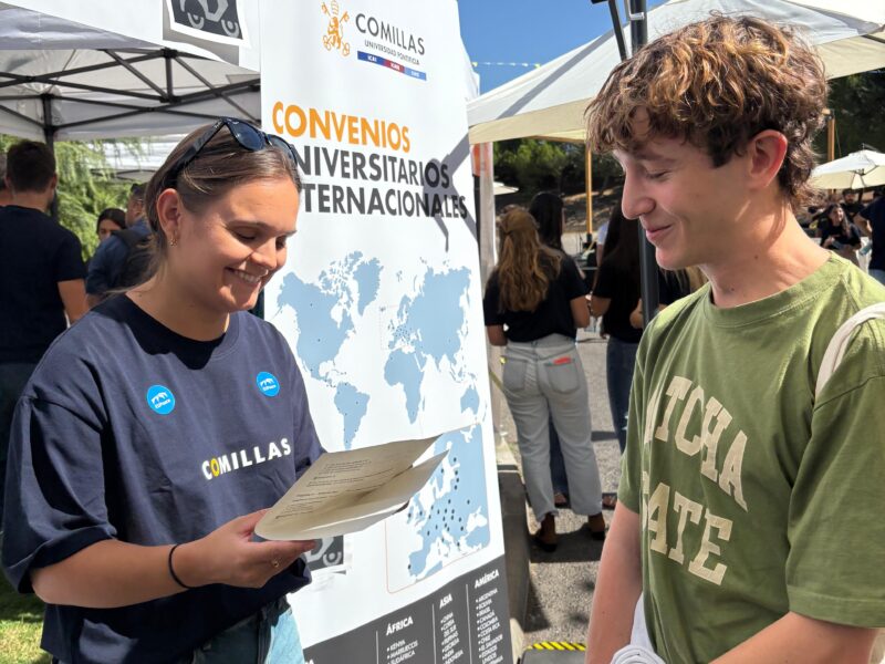 A representative from the EUPeace Team shares information with a new student at the International Relations stand.
