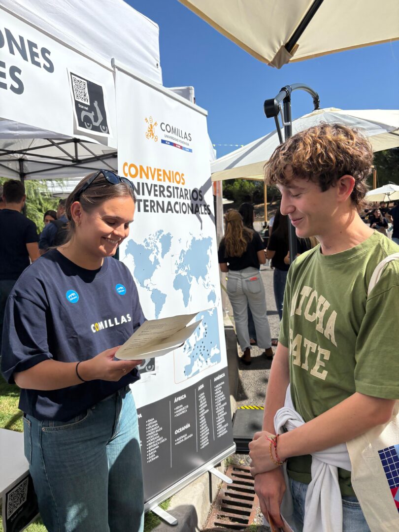 A representative from the EUPeace Team shares information with a new student at the International Relations stand.