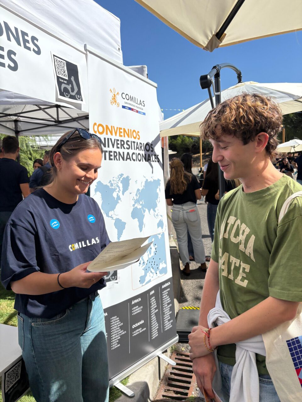 A representative from the EUPeace Team shares information with a new student at the International Relations stand.