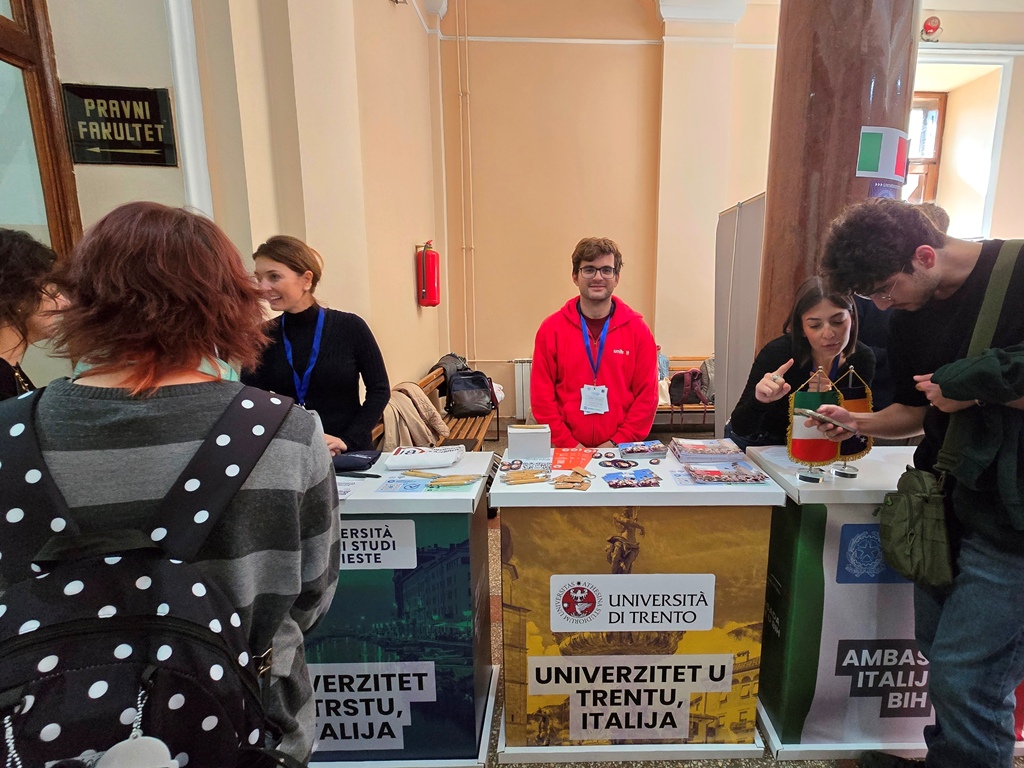 Students gather at the stands of the University of Trento, the University of Trieste and the Italian Embassy.