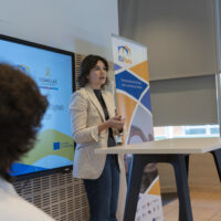 Student Adriana Pacios speaking to the audience while presenting the significance of the Sarajevo Peace Declaration.