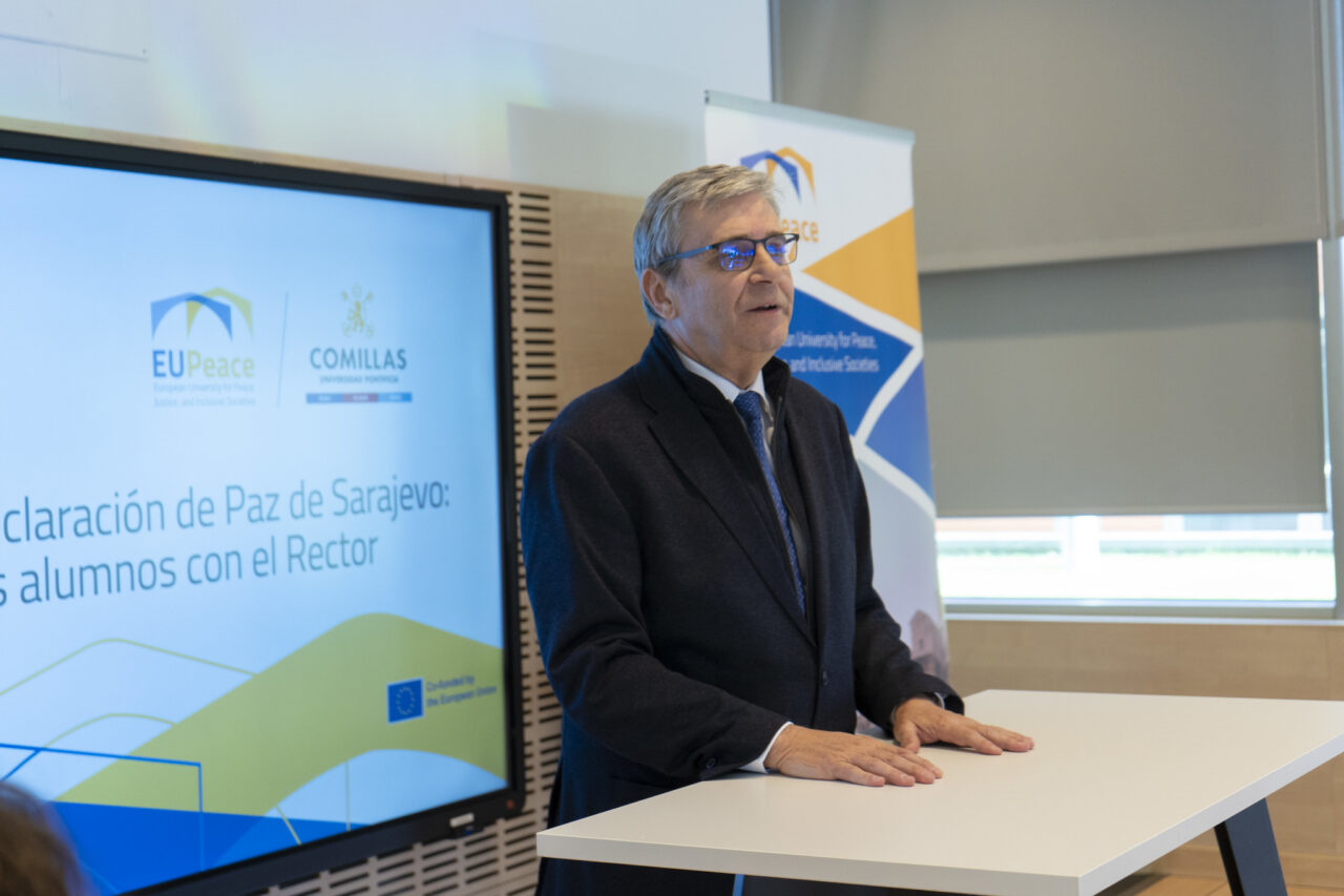 The Rector of Comillas standing, giving a speech about the Sarajevo Peace Declaration.