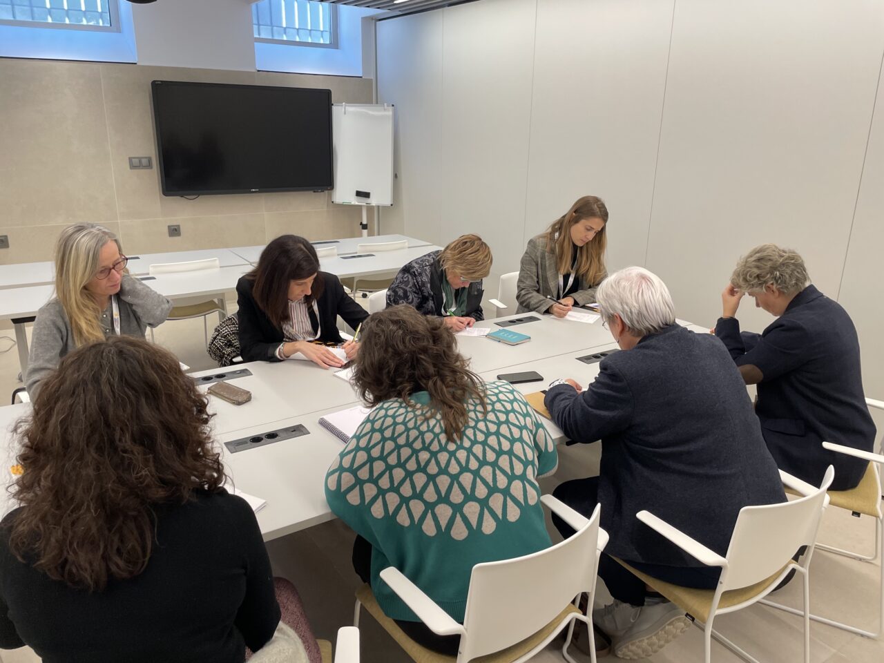A subgroup of participants discussing ideas during the Societal Dialogue Group session.