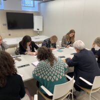 A subgroup of participants discussing ideas during the Societal Dialogue Group session.