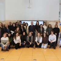 Group photo of students, staff, the Rector, and the Vice-Rector standing together.