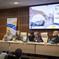 Participants of the Living Lab seated at a roundtable, discussing and reviewing the project’s conclusions.