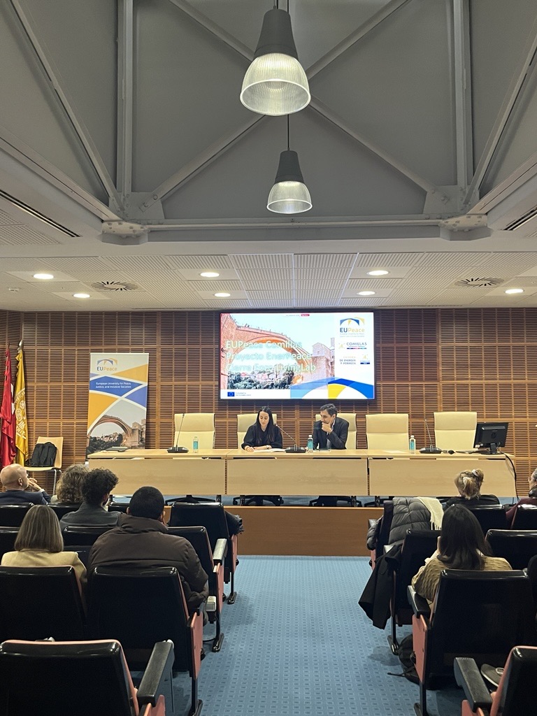 Teresa Morales, Director of EUPeace, and José Carlos Romero, coordinator of the Living Lab, standing together and addressing participants.