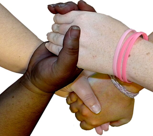 Four diverse hands holding each other in a circle.