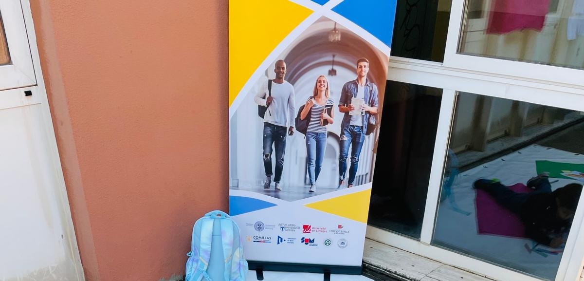 Banner of the EU PEACE project displayed at the University of Calabria during the European Researchers’ Night 2025, with student imagery and project logos.