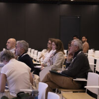 Audience seated in a conference room during an EnerPeace 2026 session at Comillas.