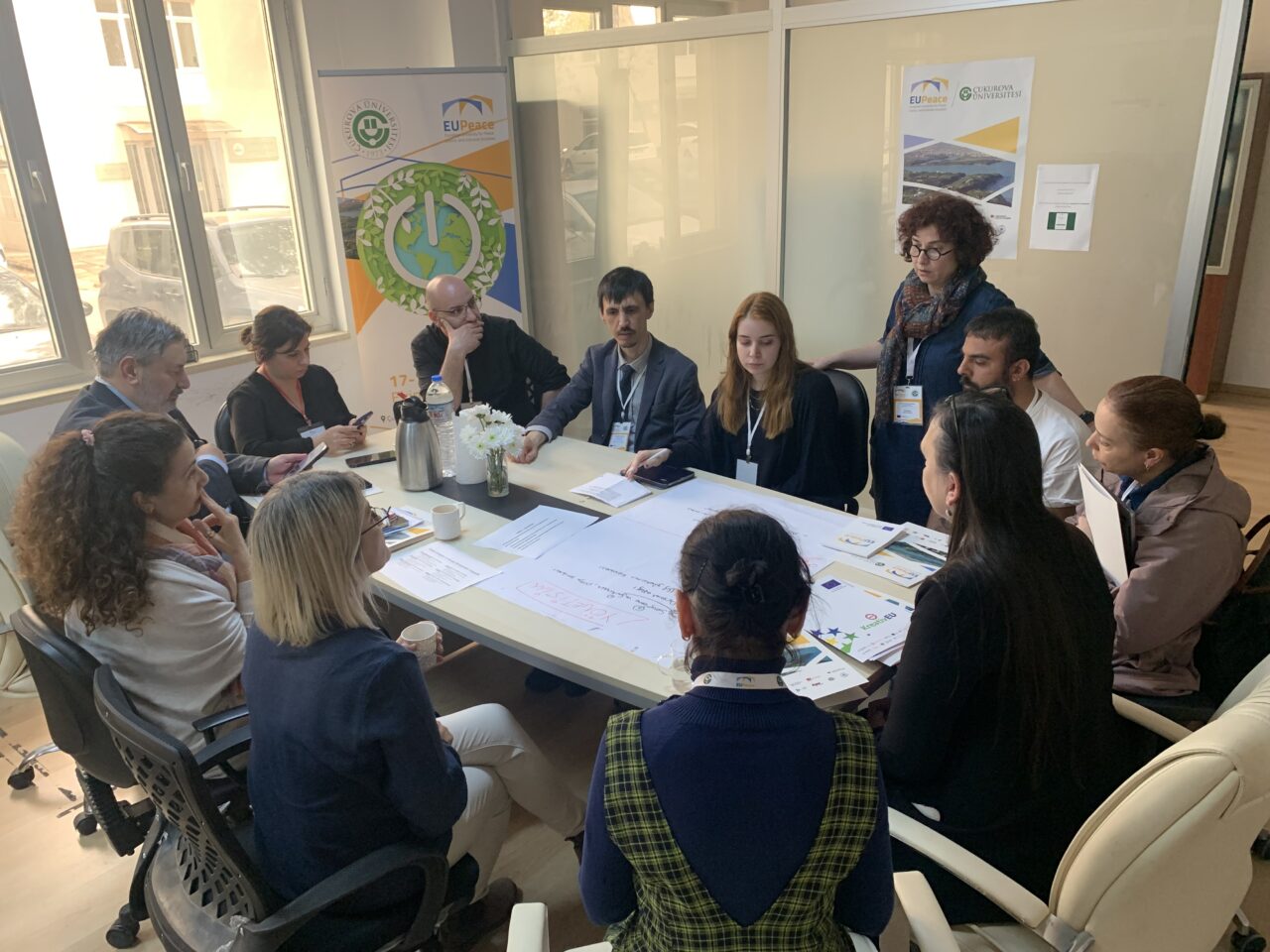 A group of education professionals meeting around a table to discuss joint programmes and quality assurance.