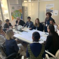A group of education professionals meeting around a table to discuss joint programmes and quality assurance.