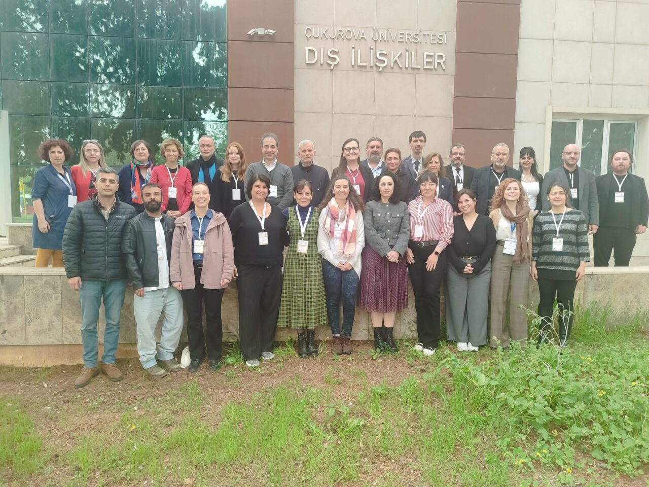 Participants of the European Universities Türkiye Workshop posing for a group photo outside a university building.