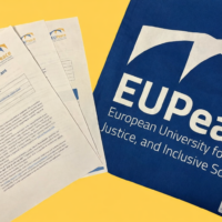 Application documents for the EUPeace Doctoral Mobility Grant 2026 on the left, a bag with the EUPeace logo on the right.